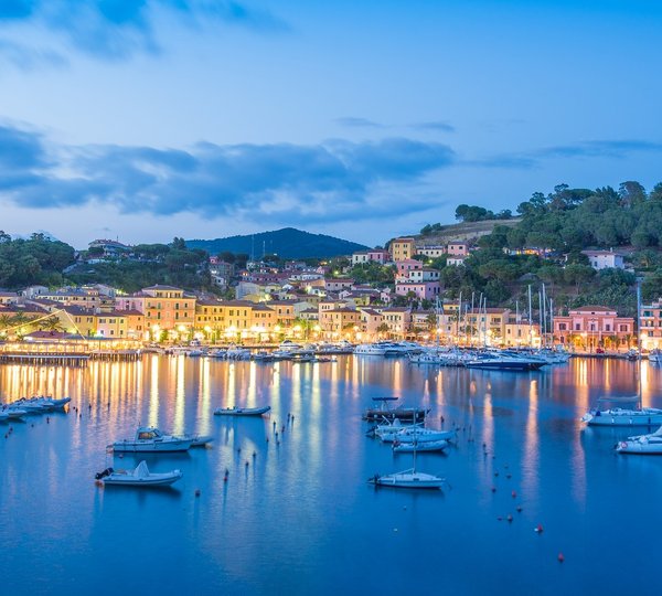 Town Porto Azzurro In Sunset Light, In Elba Island Of Italy