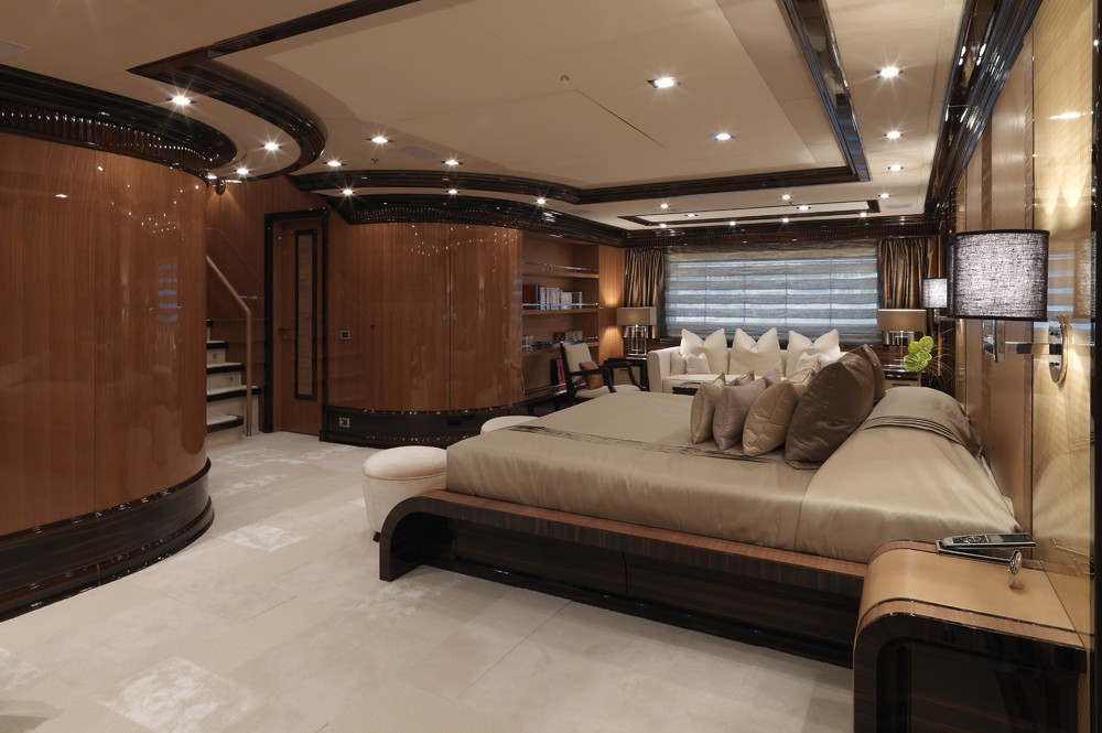 huge master suite with plush furnishings and custom-made furniture
