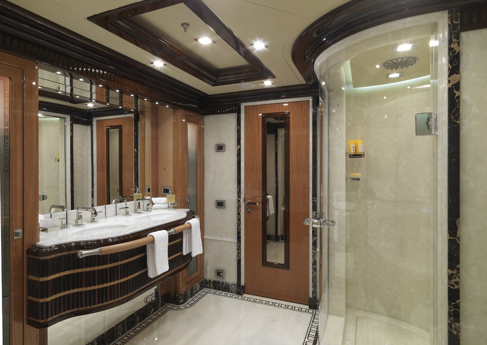 main master suite ensuite bathroom with large shower and luxurious marble details